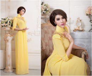 Áo dài cưới màu vàng tay phồng đính hạt đá